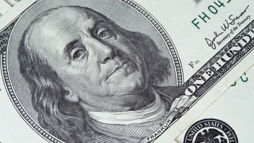 Portrait of president Benjamin Franklin on US dollar bills. Concept of illegal currency or money laundering. Financial crime, dirty money and corruption concept. Tax offense concept Royalty-Free Stock Footage #1068822704