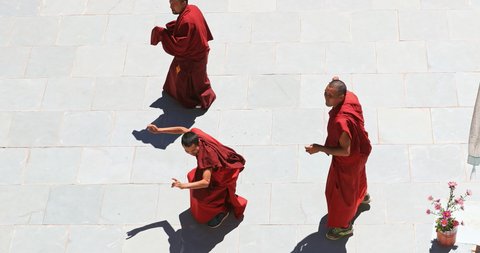 Ladakh, India - Circa 2019: Buddhist monks in traditional outfit practice religious dance in Ladakh Likir gompa