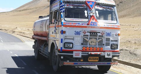 Ladakh, India - Circa 2019: Big white Tata truck drives on highway of Himachal Pradesh state in north India