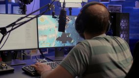 Streamer playing space shooter video game , talking with other players about e-sport tournament. Winning for mock-up video game r player, performing in streaming cyber studio,