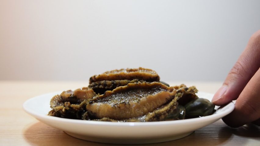 Abalone dish seasoned with soy sauce | Shutterstock HD Video #1068827012