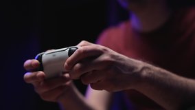 Playing video game console on tv. Hand hold new joystick. Gamer play game with gamepad controller. Gaming man holding simulator joypad. Person with keypad joystick in arms - Powered by Shutterstock - Get 15% off with code: PIKWIZARD15