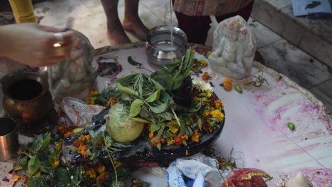 Shivratri festival in temple - Hindu Devotees offering water to Shivling or lord shiva while showing incense stick on occasion of Maha Shivratri Festival in India.
Delhi - India
11th March 2021 
