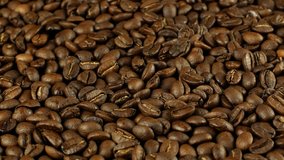 Coffee  360. Golden selected aromatic beans rotate is used to prepare a coffee drink. 4k video food and drinks.