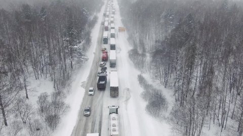 Flying an aerial drone. Thousands of people were stranded on the highway as a heavy snowstorm and blizzard hit hard.