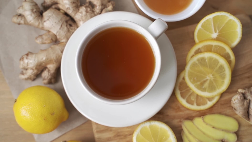 Ginger, honey, lemon and lime herbal tea preparation with high levels of Vitamin C, boosting the immune system. Royalty-Free Stock Footage #1068836837