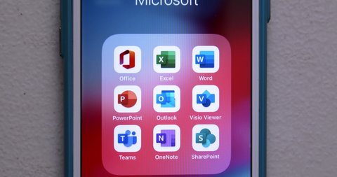 Kumamoto, JAPAN - Mar 2 2021 : Zoom out Microsoft Office apps on iPhone. It is a family of client, server software by Microsoft. The 1st version of Office contained Word, Excel, and PowerPoint