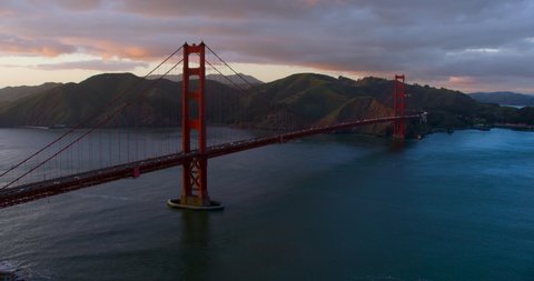 High aerial view of the Golden Gate Bridge. San Francisco, US. It connects the San Francisco peninsula to Marin County. US route 101 and SR 1 full of traffic. Shot on Red weapon 8K.