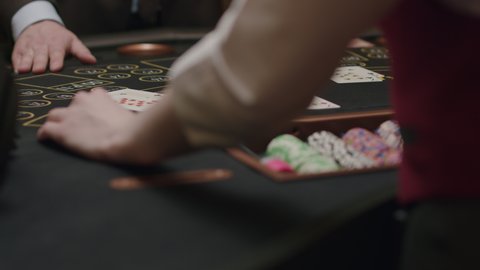 blackjack player place him bets at an elite casino. Gambling, nightlife