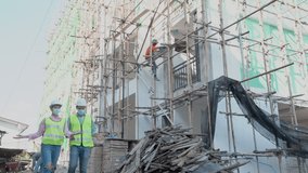 Team of caucasian man contractor, woman engineering wear face mask, take off them safety helmet, elbow bump after finish inspect, defect of building, apartment. Prevent, safety coronavirus concept. - Powered by Shutterstock - Get 15% off with code: PIKWIZARD15