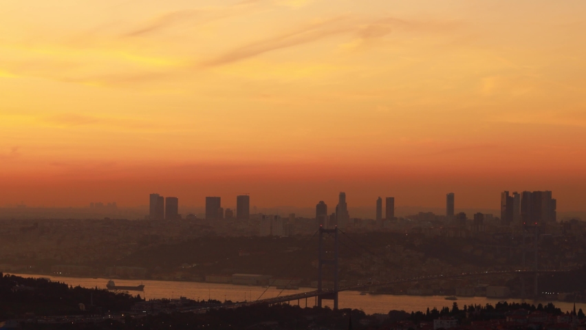 Views of the Bosphorus and the city of Istanbul. Orange Sunset and Darkness