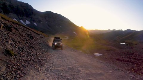 Sunset Jeep Trail Drive Offroad In The Mountains. 
