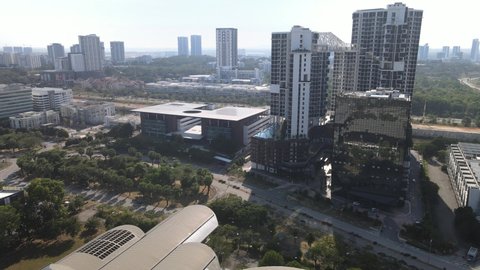 Aerial view of apartment, offices, shop lots, sky and garden in Cyberjaya.