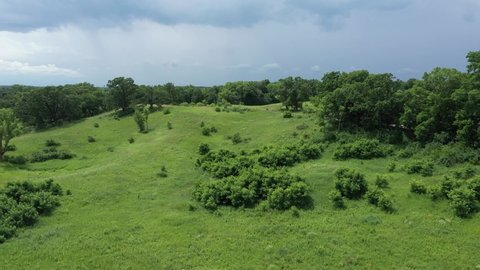 Green hills along a hiking trail on a summer day at the Chain o' Lakes State Park in Lake County, Illinois