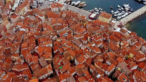 View from the height of the narrow streets and roofs of houses with red tiles.