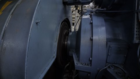 Rotation of flywheel of large engine and gear of shaft generator.