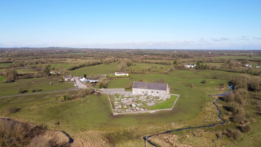 Aerial view of the oldest Irish Roman Catholic church at Meelick village in County Galway, Ireland. A magnificent location on the banks of the River Shannon.