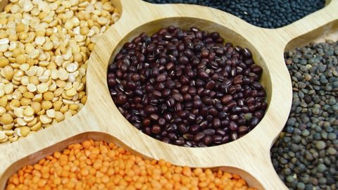 mix of legumes on wooden table. rotation legumes close up. legumes on wooden table.healthy diet, vegetarian food footage. Legumes Dlicious and Healthy Natural Mix Food 