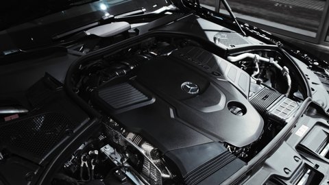 The engine of the newest Mercedes-Benz S-Class W223. The engine compartment of a new car with a 6-cylinder engine