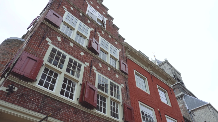 Details of Fascades on Central square of Delft City in Netherlands surrounded by old Dutch houses