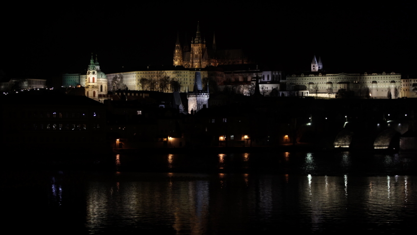  Prague Castle and St. Vitus Cathedral and Charles Bridge on the Vltava River in the center of Prague at night Royalty-Free Stock Footage #1068915902