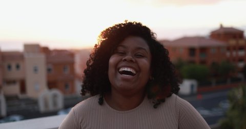 Young african woman smiling on camera