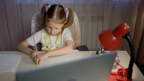 Schoolgirl Girl Studies Online On Laptop At Home.