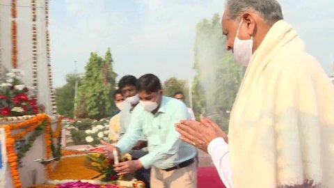 Jaipur, India, March 12, 2021: Rajasthan Chief Minister Ashok Gehlot pays floral tribute to Mahatma Gandhi on the 91st anniversary of Dandi March or Salt Movement, at Gandhi Circle in Jaipur.
