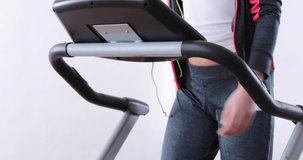 4k video of young woman  working out on an treadmill at the gym