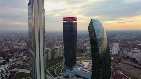 Glass buildings in Europe City Life. Aerial view of modern architecture of office buildings in new city districts. drone shoots three towers. Milan, Italy, February 2021: 