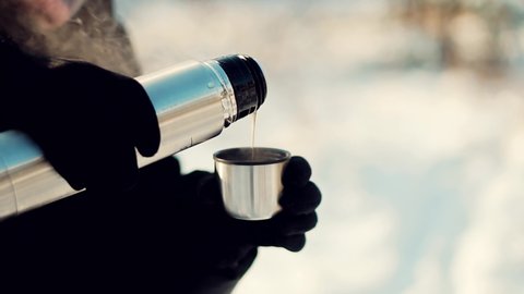 Woman Pouring Tea Into Cup. Hot Coffee From Thermos. Holiday Vacation Trip And Relaxing Moment. Traveler Enjoying Hot Tea In Mug On Forest Adventure. Refreshment From Thermos On Hiking At Cold Weather