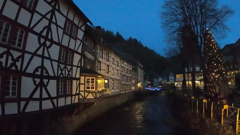 Monschau, Germany - December 28, 2019: Half-timbered houses along the Rur river in Monschau. The town is a small resort town in the Eifel region of western Germany, located in the Aachen district.