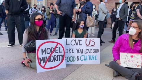 Demonstrators take part in a rally “Love Our Communities: Build Collective Power” to raise awareness of anti-Asian violence, in Los Angeles, on March 13, 2021.