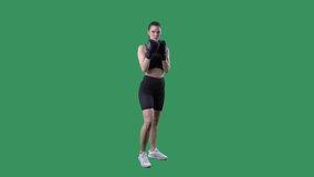 Female kick boxing fighter doing high kicks in slow motion. Full body on green screen chroma background.  - Powered by Shutterstock - Get 15% off with code: PIKWIZARD15