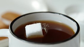 Super slow motion sugar cube landing dark roast coffee | Phantom - Powered by Shutterstock - Get 15% off with code: PIKWIZARD15