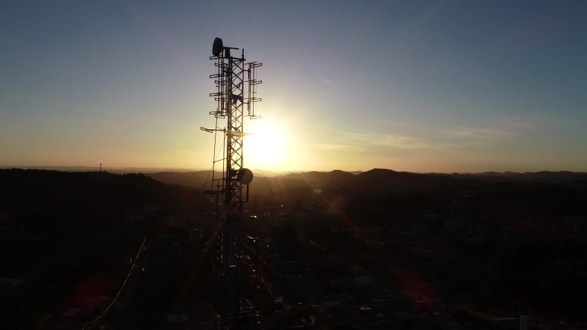 Antenna tower with sunset background