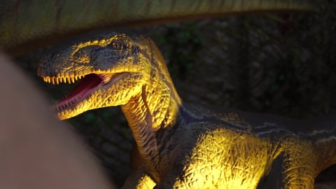 Closeup giant predator velociraptor dinosaurus with sharp teeth