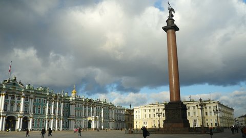 St. Petersburg, Russia, January 29, 2020. low heavy clouds over the Palace Square, the Winter Palace and the Alexander Column, tourists walk see the sights, time lapse
