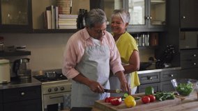 Animation social media like and love icons over senior couple cooking together in kitchen. global social media networking, connection and communication concept digitally generated video. - Powered by Shutterstock - Get 15% off with code: PIKWIZARD15