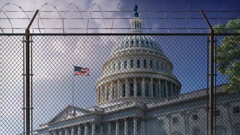 U.S. Capitol Building Behind Razor Wire Fence 4K Loop features a straight-on view of the U.S. Capitol Building with flag in the wind behind razor wire fence with clouds moving in the background in a l