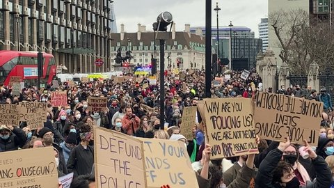 LONDON - 14TH MARCH 2021: Protesters marching to Parliament Square to protest against police brutality and for women's rights. In response to the murder of Sarah Everard on the 3rd of March.