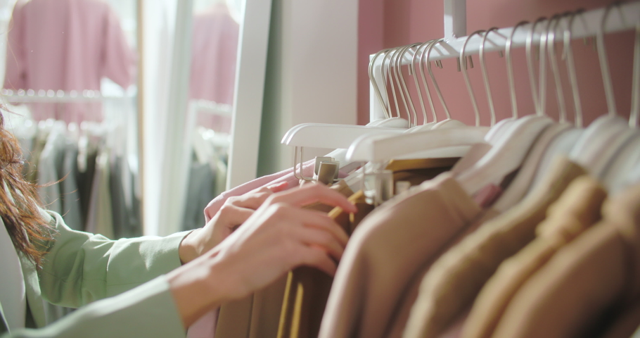 Clothing Store. Women s Clothing Hangs on Hangers Inside the Store. Buyers Choose Things. Boutique. Close-up. Shopping. A Lot of Clothes in Various Styles. Dresses, Jackets, Shirts, Skirts, and Other | Shutterstock HD Video #1069009513