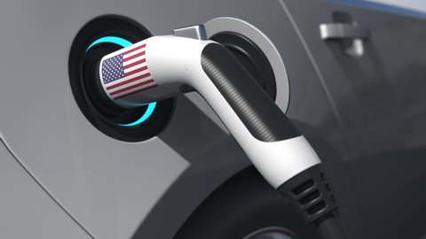 Flag of the USA on the charging plug in an electric car. Conceptual 3d animation