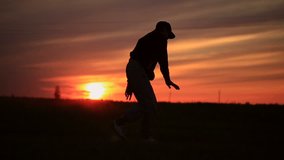 Silhouette Man break dance at sunset
