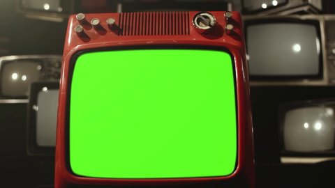 Retro Television turning on Green Screen Among Many Retro TVs. Dolly In. 4K Resolution.