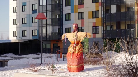 pagan holiday in modern Russia. Maslenitsa. a female figure made of hay in traditional dress, symbolizing the winter before the burning.