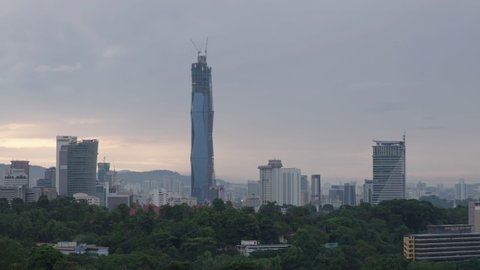 4k establishing cinematic b-roll shot of sunrise scene at Kuala Lumpur city skyline. 