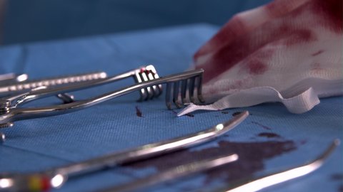 CU Bloodied Surgical Instruments On Table
