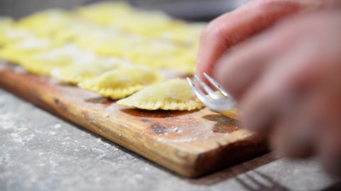 Preparing traditional italian ravioli. Homemade italian pasta.