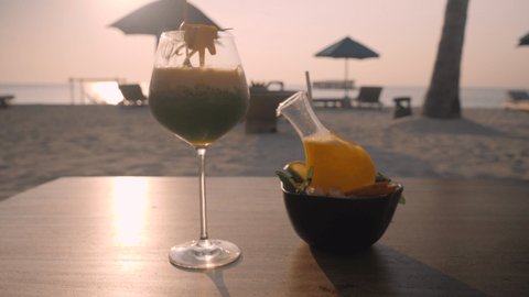 Cocktails on the beach at sunset 